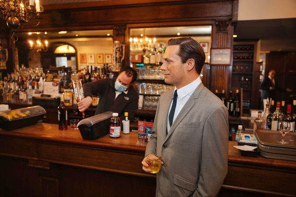 NYC Steakhouse Stunt: A Wax Don Draper Hanging at the Bar